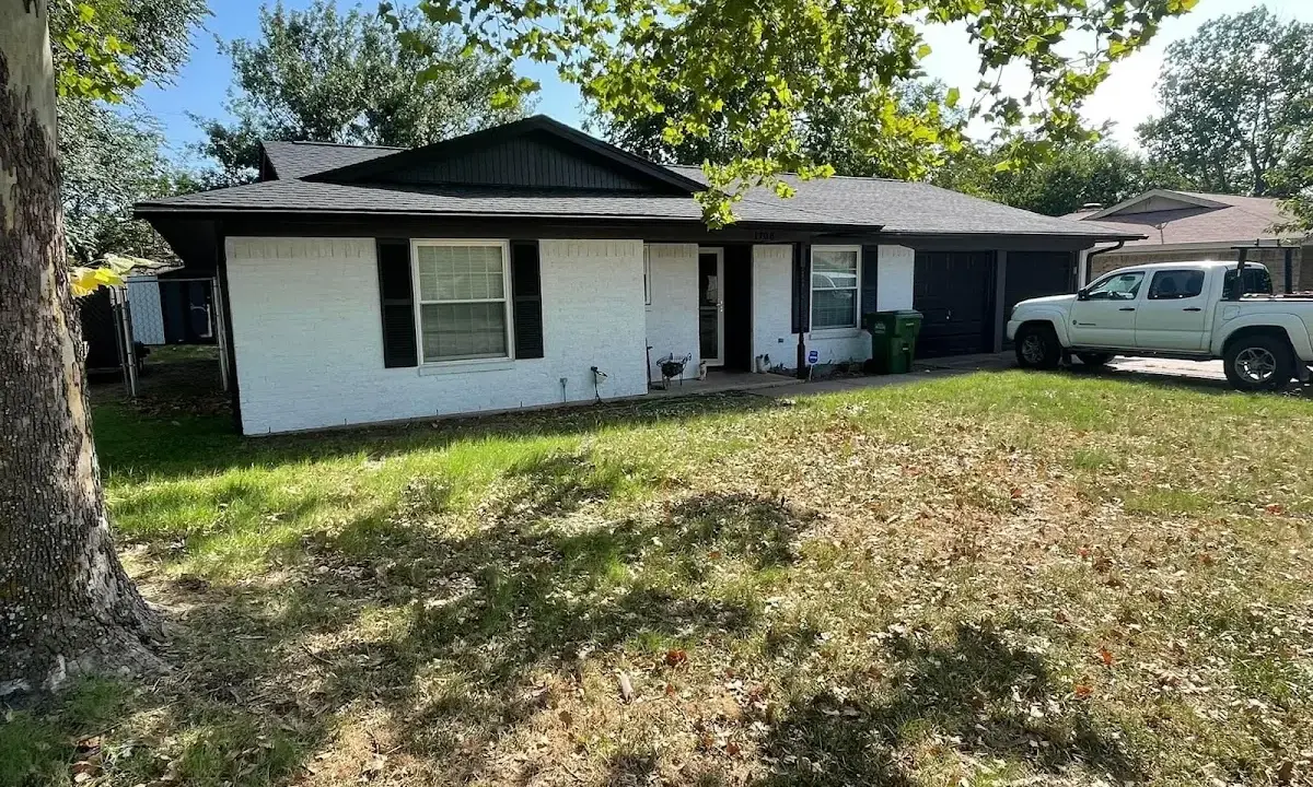Professional roofing crew working on a residential roof in Centralia